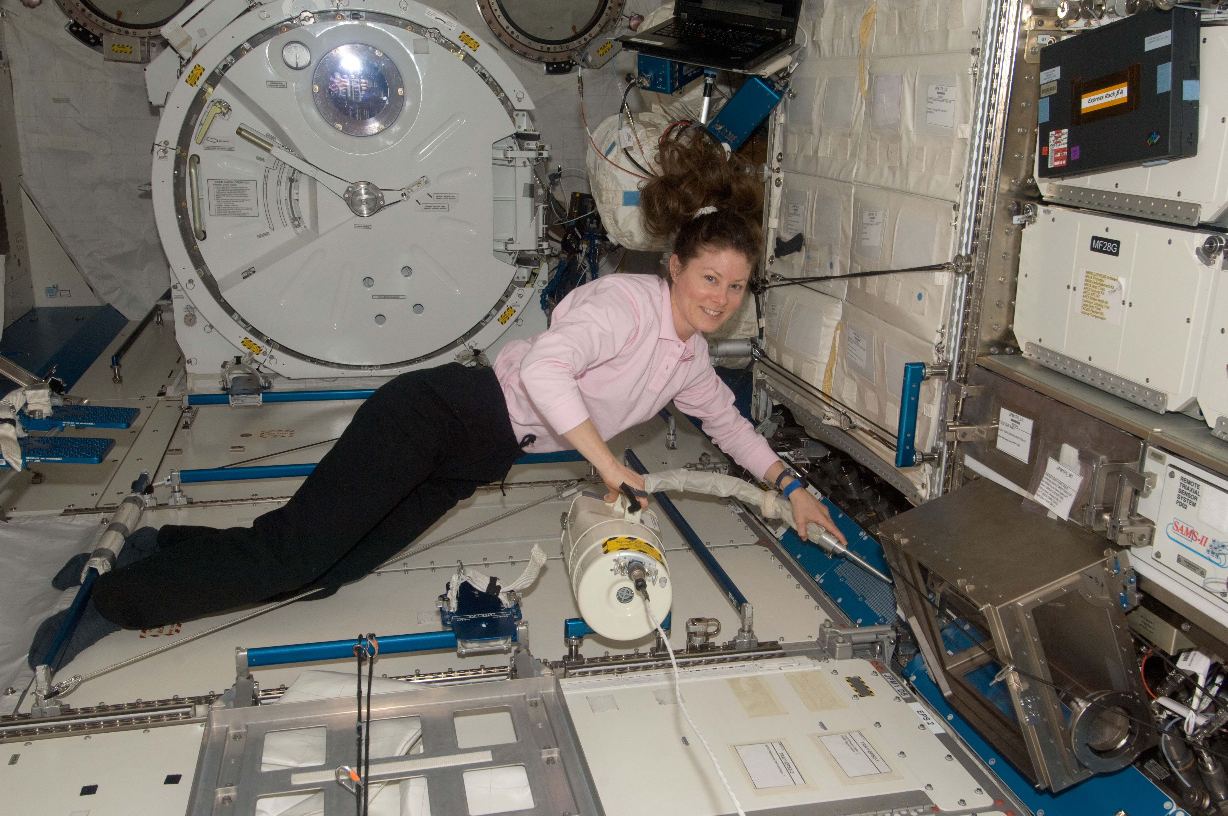 ISS-24_Tracy_Caldwell_Dyson_during_housekeeping.jpg