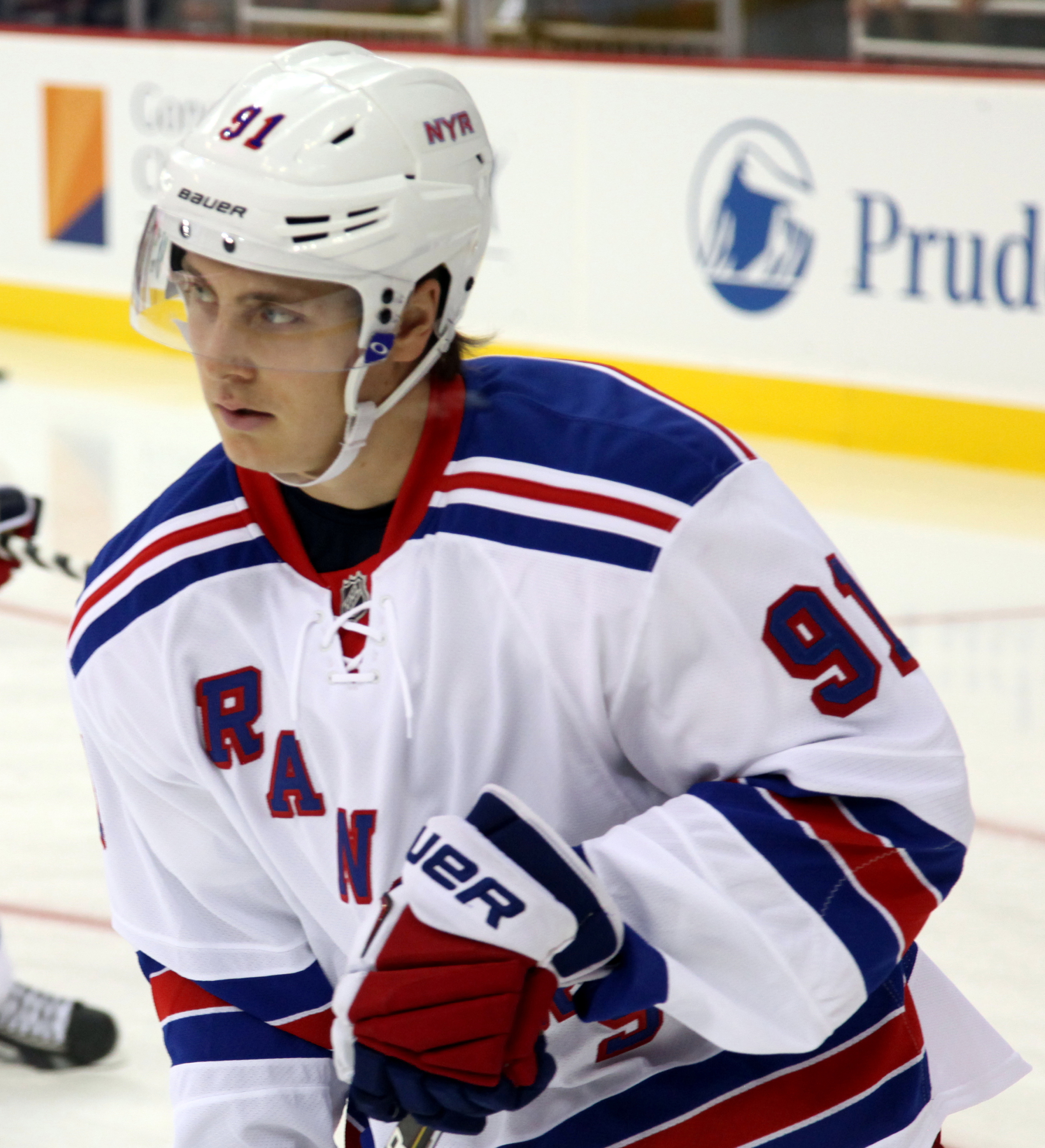 New York Rangers Ryan Callahan (24) is hit hard into the boards by