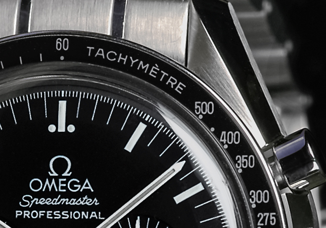 File Tachymeter scale and stop watch push button of Omega