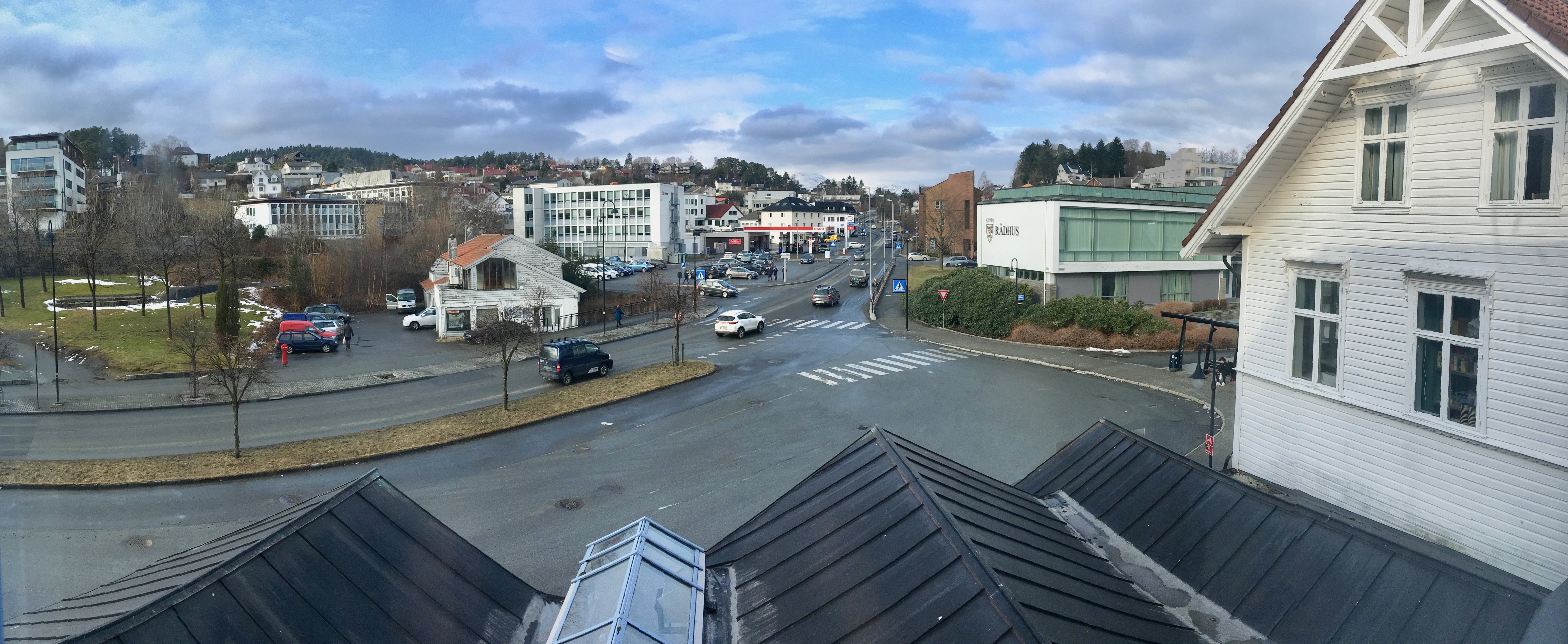Distorted (compressed) panorama of Leirvik, Stord, Norway, seen from Grand Hotell. Stord town hall, bus station, Esso petrol station, Heimebaserte tenester, Vikabrekko (fylkesveg 544) etc. 2018 03 09 leirvik