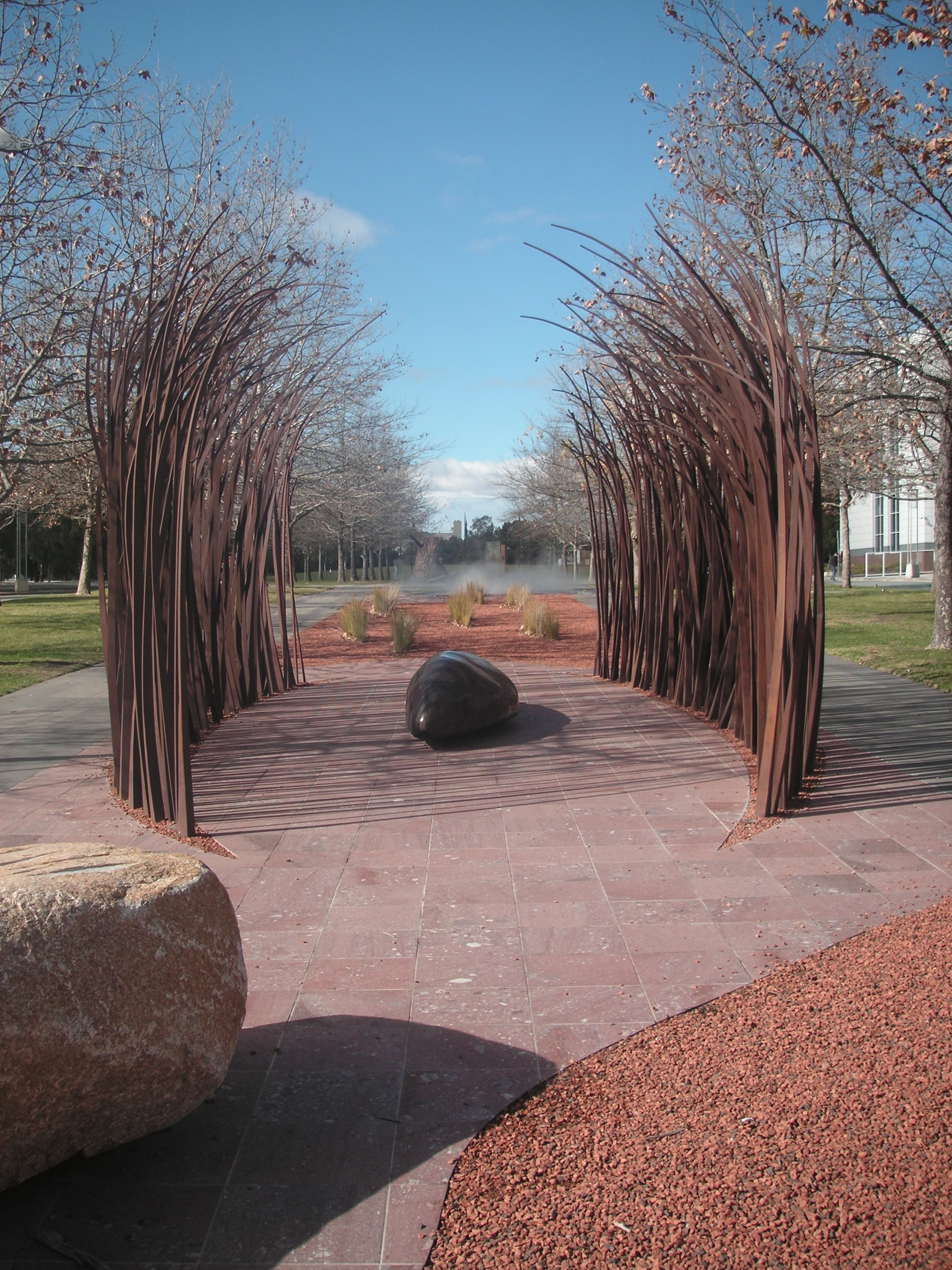 Sculpture ''Fire and Water'' (2007) by Judy Watson at [[Reconciliation Place]] in [[Canberra]].