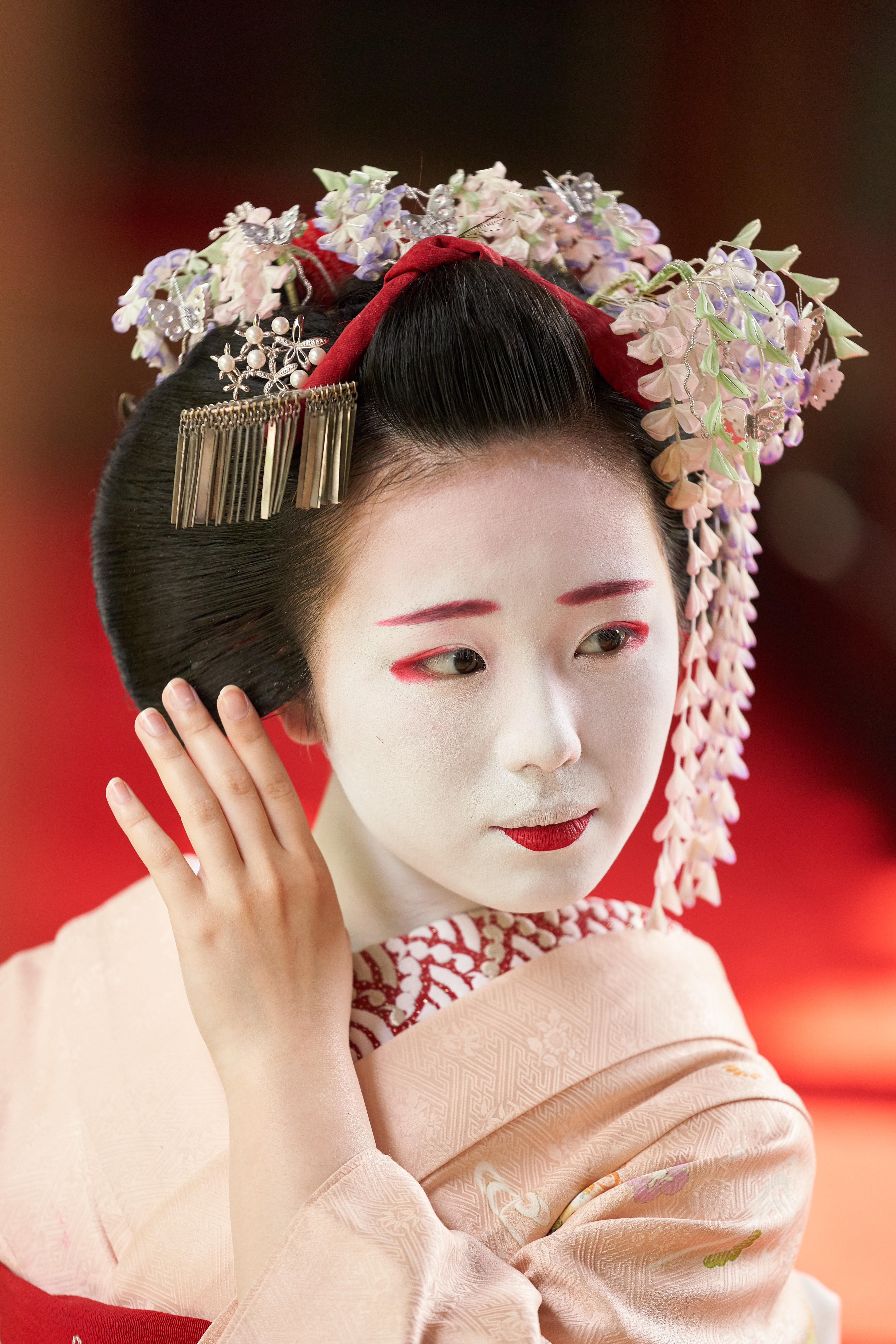 Image of Japanese Maiko Or Geisha In Red Kimono Coifed Hair Brooch With  Patterns Of Red And White Plum Blossoms-TW359880-Picxy