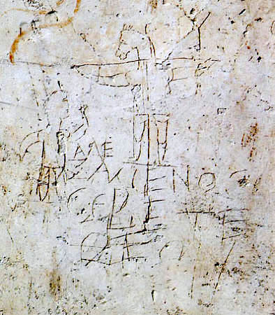 Jesus am Kreuz mit Eselskopf, um 200. Das Graffito, wohl mit einem Nagel in den Putz geritzt, soll einen Christen verhöhnen. (Foto: wikimedia.com)