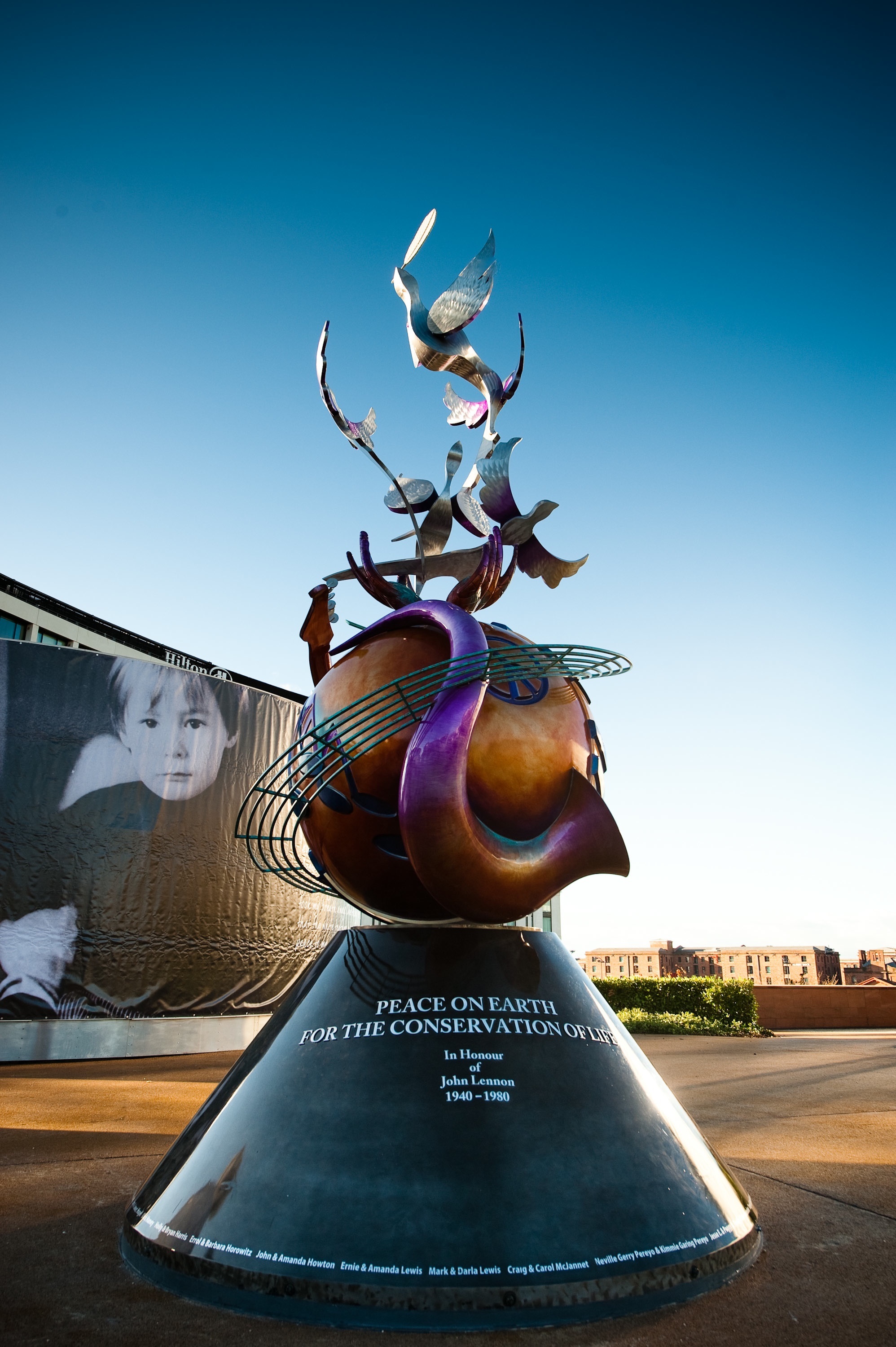 John Lennon Peace Monument in Chavasse Park, Liverpool, England. Photo by Lauren Voiers. This photograph is in the public domain.