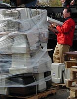 Computer monitors are typically packed into low stacks on wooden pallets for recycling and then shrink-wrapped. Recycling Computers.jpg