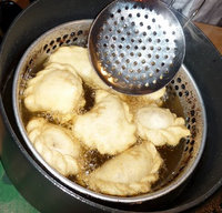 A strainer used in the preparation of empanadas