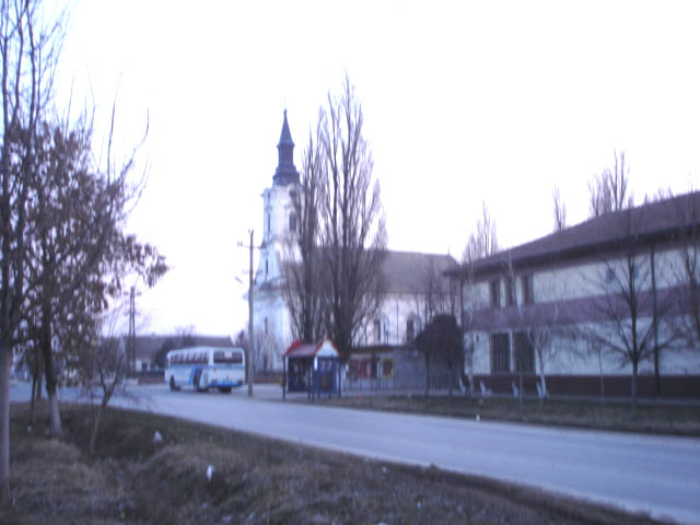 File:Kumane, main street and the Orthodox Church.jpg