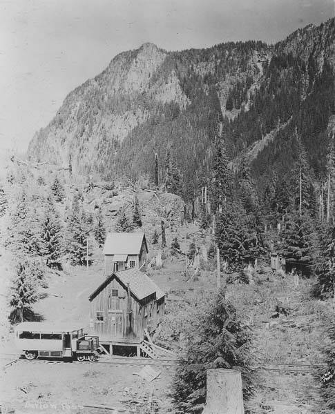 File:Penn Mining Company Warehouse with US Forest Service guard station, behind, on Hartford Eastern Railroad at Barlow Pass (WASTATE 3521).jpg