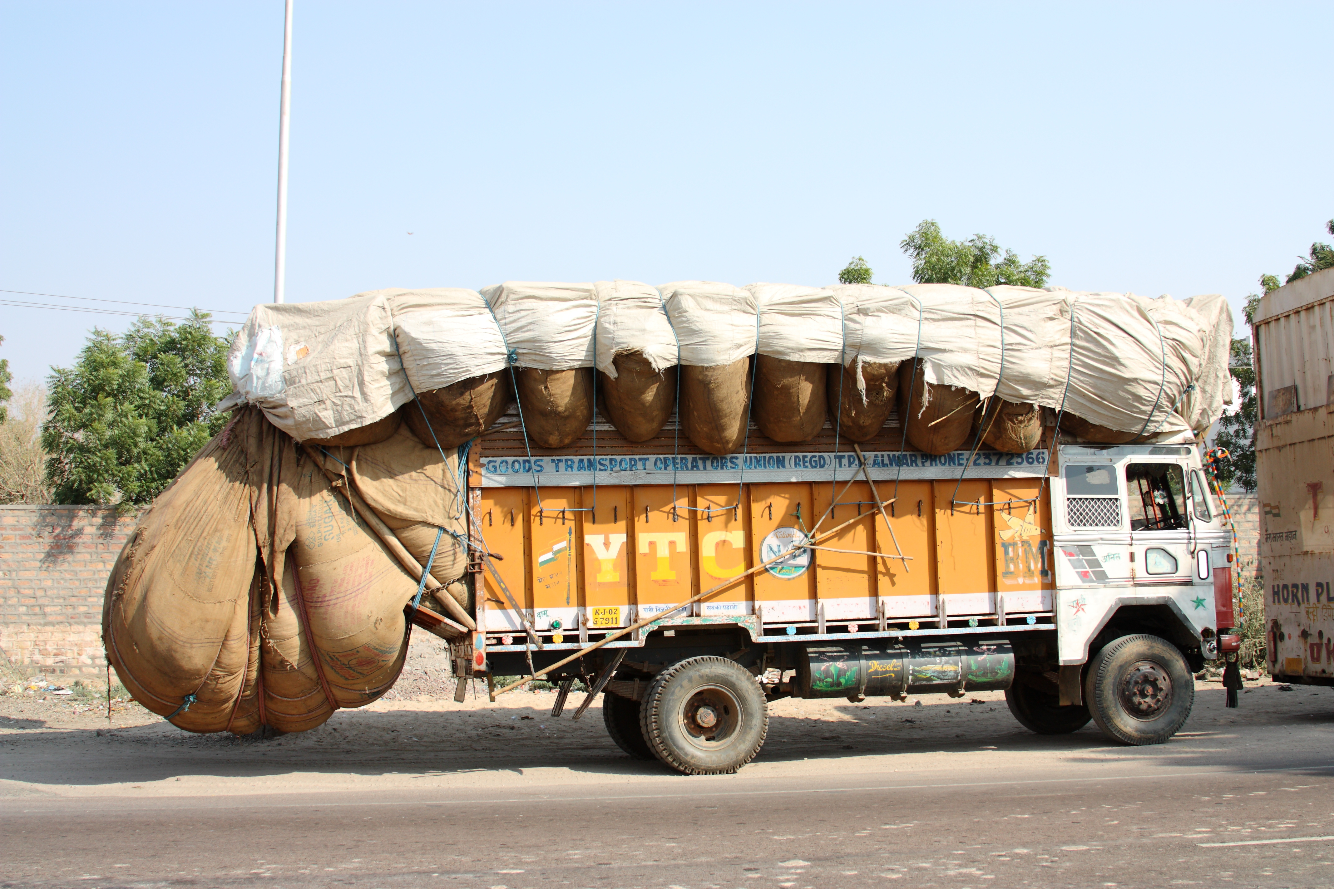 Stock photo of Typical rural transport, overloaded van with people,  Maharashtra, India. Available for sale on