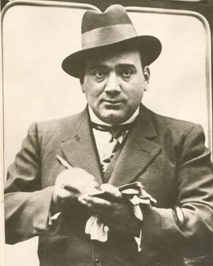 Caruso signing his autograph; he was obliging with fans