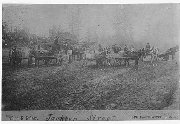 File:Jackson St between 11th Ave and 12th Ave, showing several men with horse-drawn carts, Seattle, 1883 (PEISER 33).jpeg