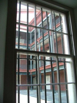 View through a window in the old U.S. Mint showing one of the rear courtyards
