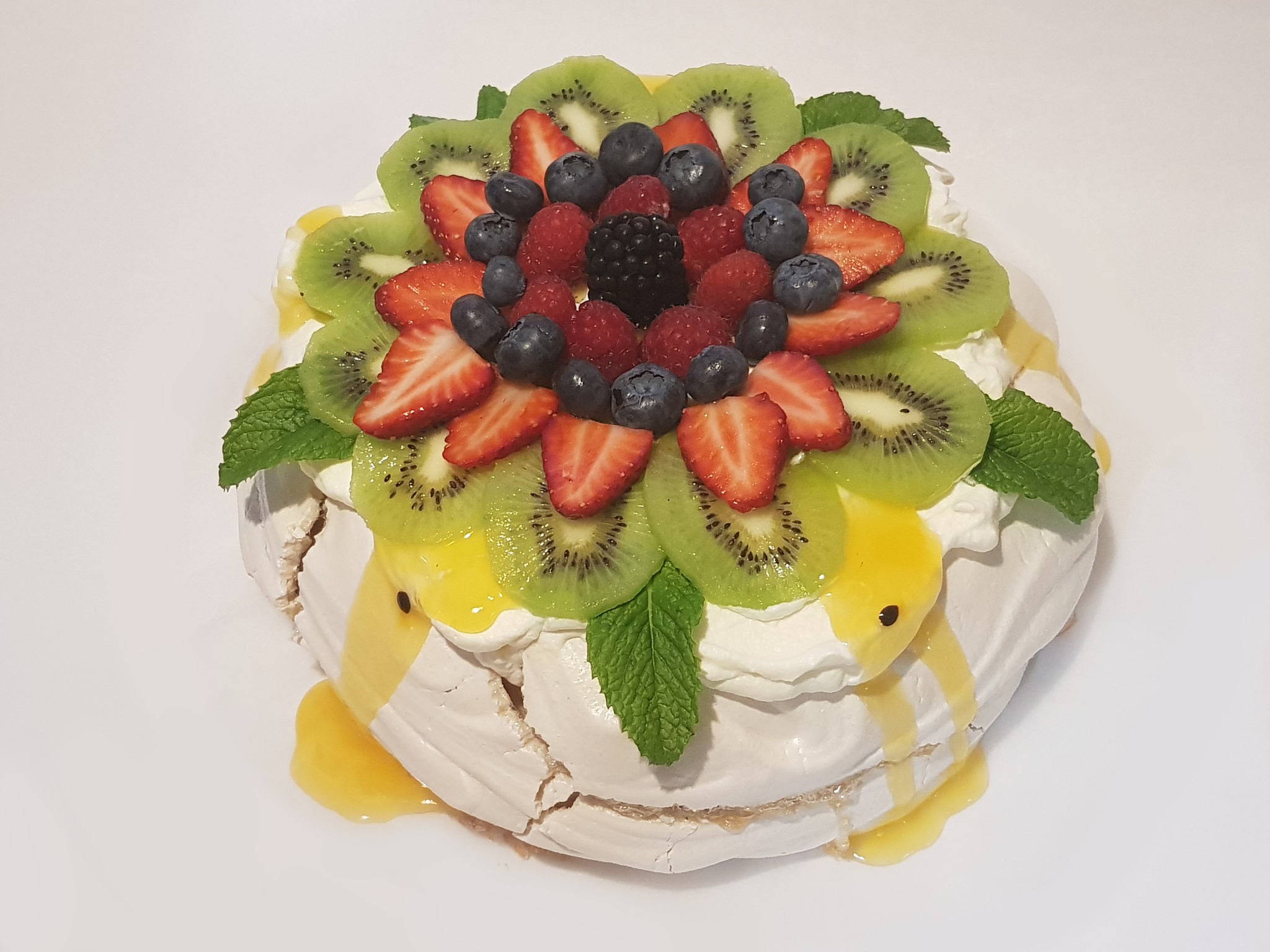 Pavlova cake with berries & cream recipe | BBC Good Food