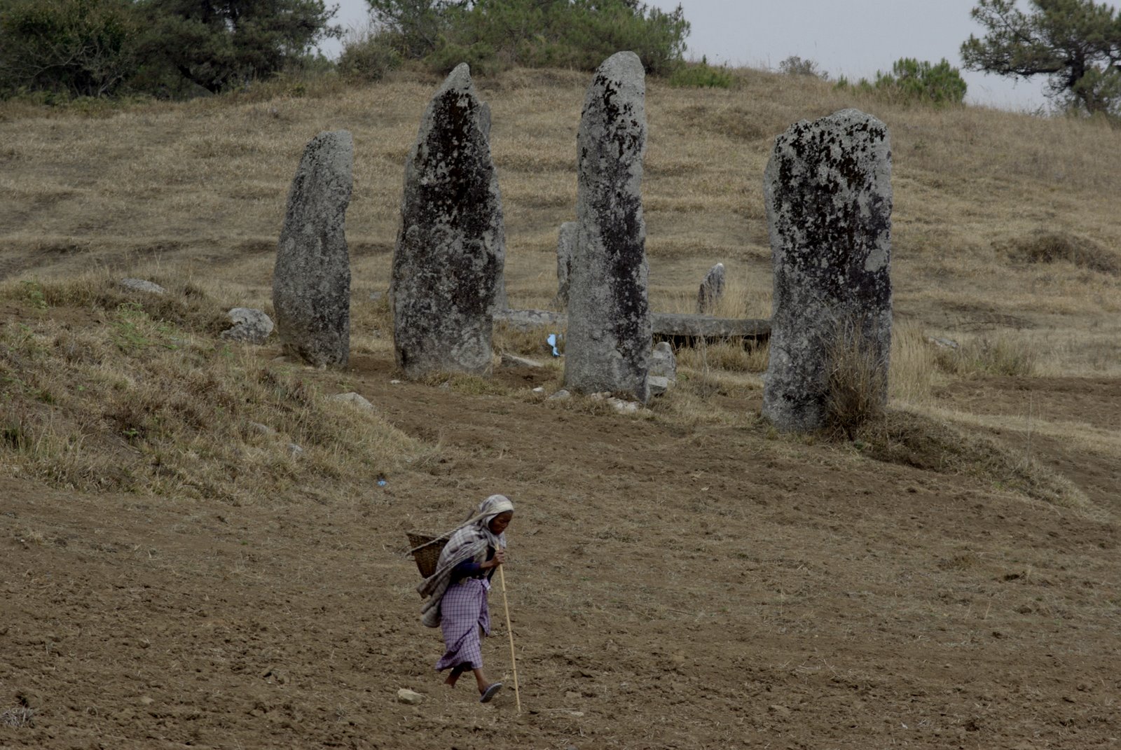 Khasi women and standing-stones, near Laitlyngkot, Meghalaya, India