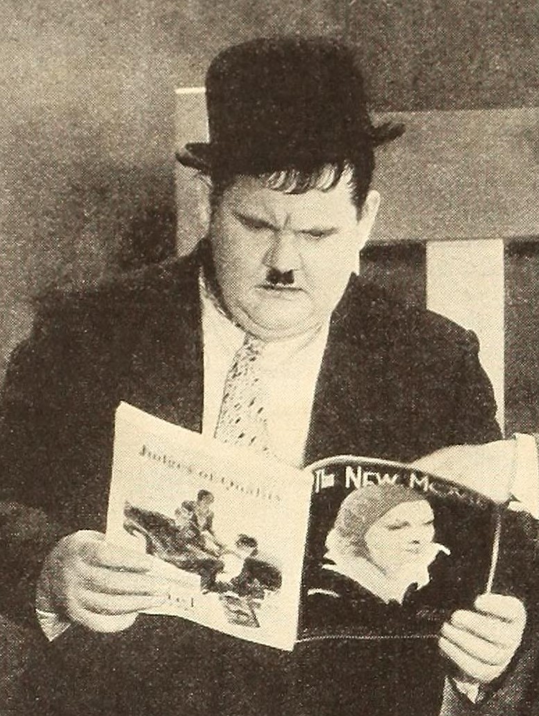 File Oliver Hardy Reading The New Movie Jpg Wikimedia Commons