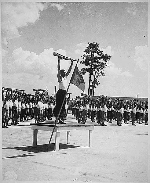 File:"Men of the Sixteenth Battalion, crack all-Negro training unit at the Field Artillery Replacement Center, Fort Bragg, NC, are shown in their daily rifle calisthenics. After nine weeks training the men have develope(...) - NARA - 531155.gif