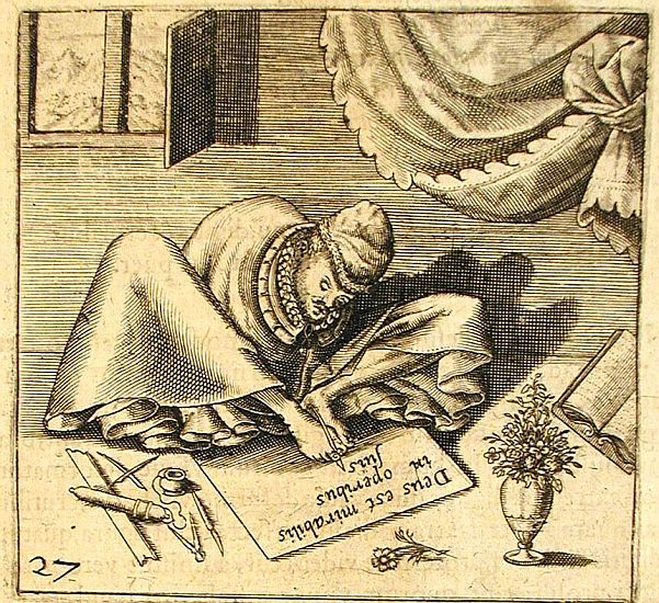 A man in a voluminous robe sits on the floor and writes with a pen held in his feet. He has no arms.