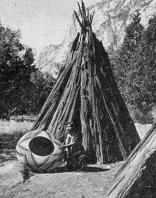 Lucy Telles in front of her tomogani  with her largest basket, Yosemite National Park, 1933