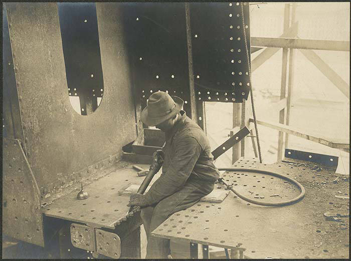 File:Moran Brothers employee operating a compressed air chipping gun, Seattle, circa 1902 (MOHAI 8911).jpg