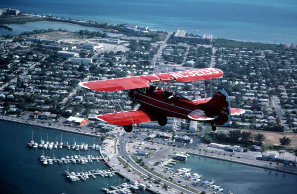 File:Freddy Cabanas in his Waco bi-plane over Key West (8517659771).jpg