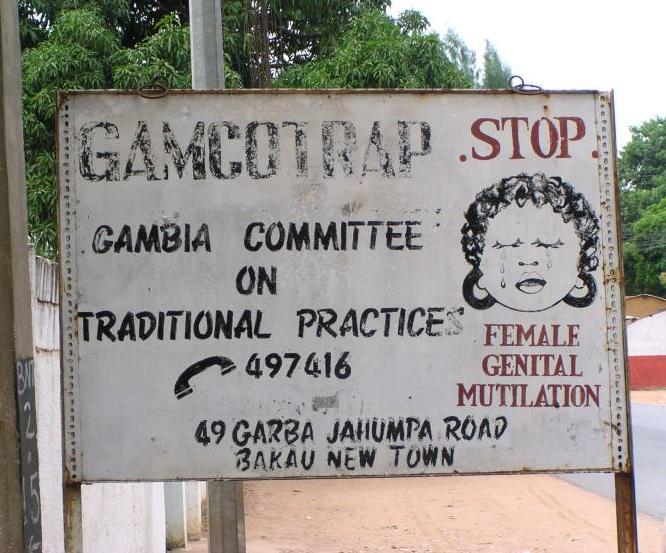 https://upload.wikimedia.org/wikipedia/commons/b/b6/FGM_road_sign%2C_Bakau%2C_Gambia%2C_2005.jpg