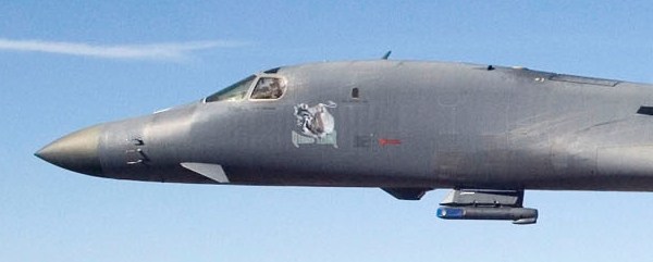 Sideview of a B-1B's nose section, which features a Sniper XR pod mounted on its chin
