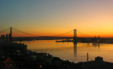 The Ben Franklin Bridge at sunrise, connecting Camden, at right, to Philadelphia