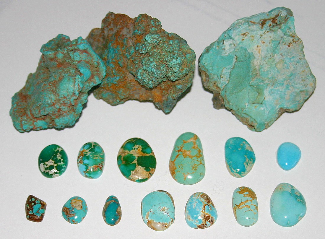 Untreated turquoise, Nevada, US. Rough nuggets from the McGinness Mine, Austin. Blue and green cabochons showing spiderweb, Bunker Hill Mine, Royston