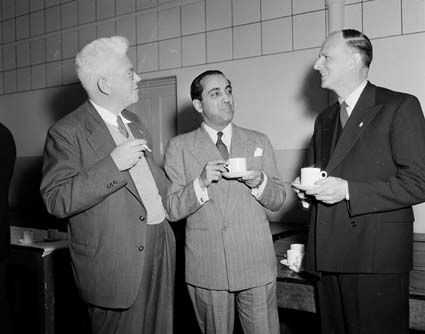 During a two-day symposium on "Atomic Power in Australia" at the New South Wales University of Technology, Sydney, which began on 31 August 1954, Oliphant (left), Homi Jehangir Bhabha (centre) and Philip Baxter (right) meet over a cup of tea