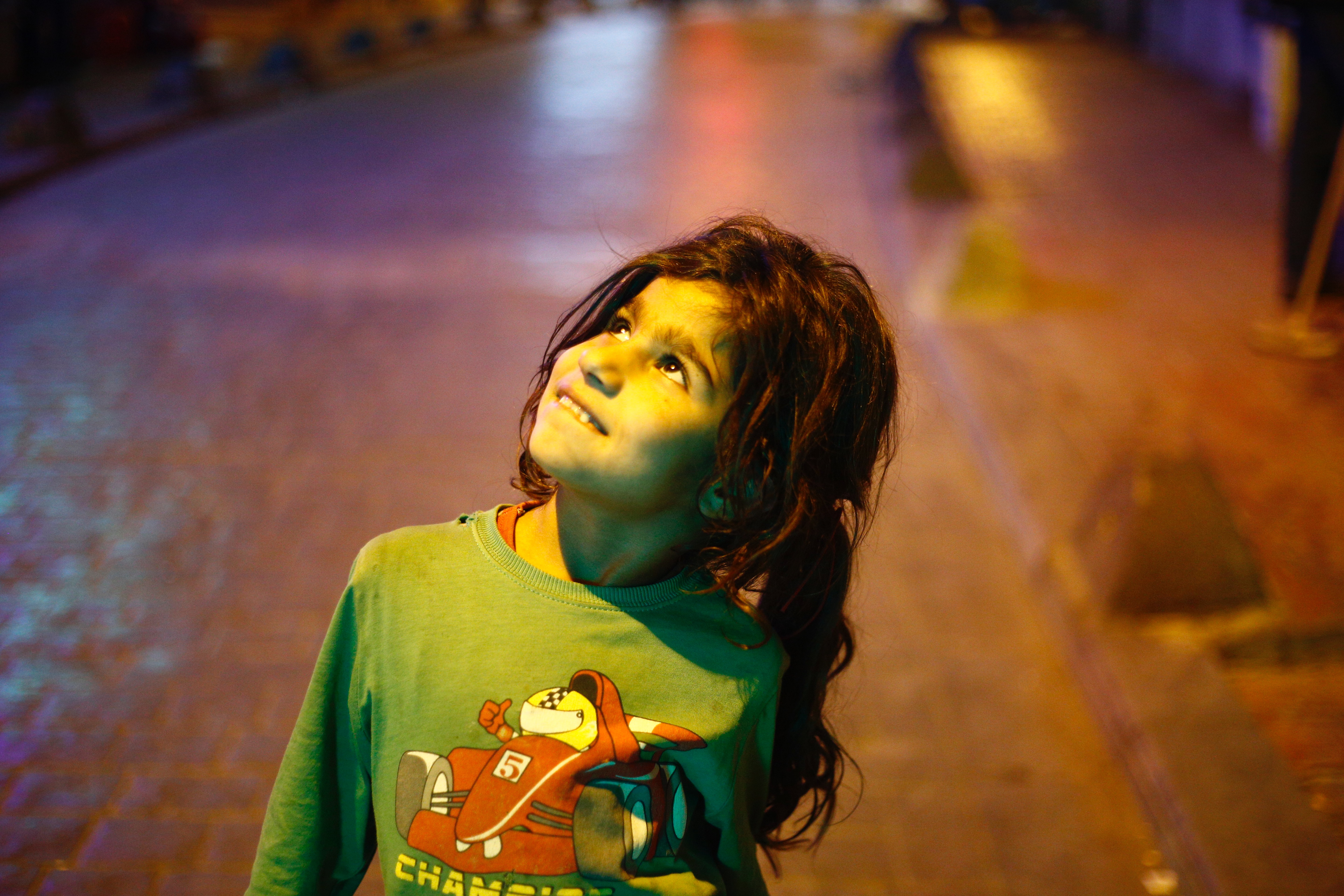 A Syrian refugee girl with a hopeful expression