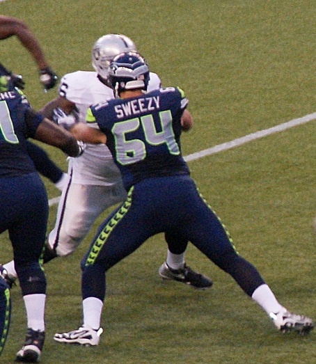 J. R. Sweezy blocking a Raider