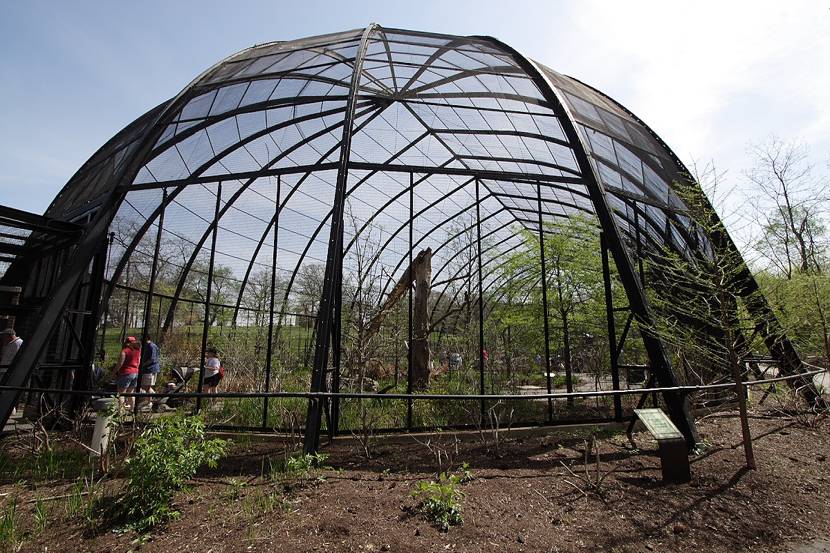 A very tall and long oval-shaped cage.