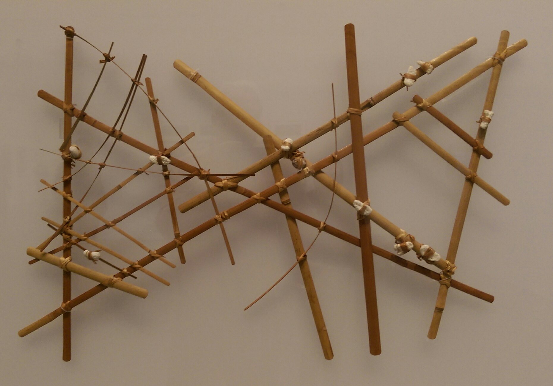 A navigational chart from the Marshall Islands, on display at the Berkeley Art Museum and Pacific Film Archive. It is made of wood, sennit fiber and cowrie shells. From the collection of the Phoebe A. Hearst Museum of Anthropology at the University of California, Berkeley. Date not known. Photo by Jim Heaphy.