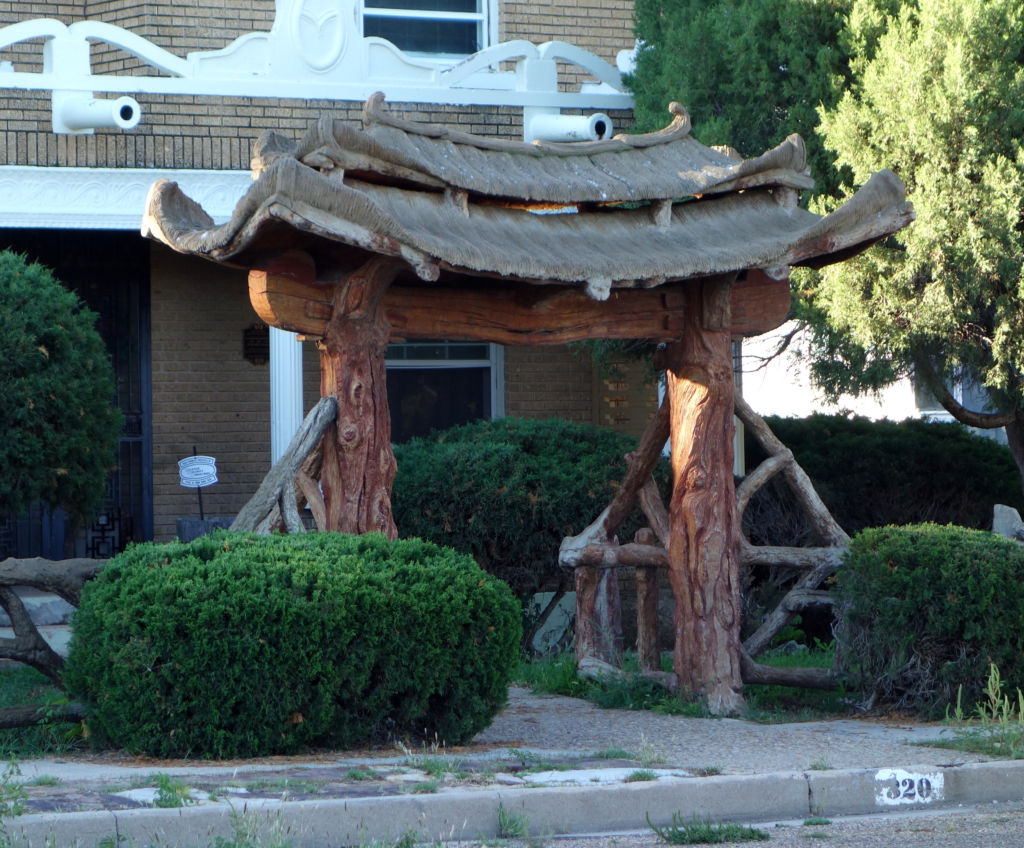 Photo of Gate, Fence and Hollow Tree Shelter Designed by Dionicio Rodriguez