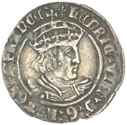 A silver halfgroat from the second coinage of Henry VIII. Silver is worn after time in circulation, and base alloy is visible. Coins such as this earned Henry VIII the nickname "Old Coppernose".