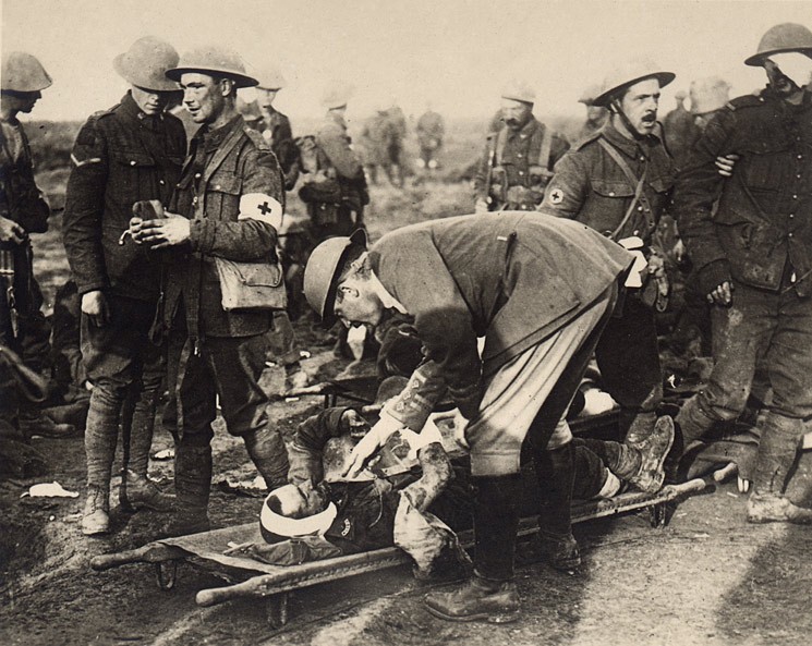 File:Wounded soldier clinging to a german helmet.jpg