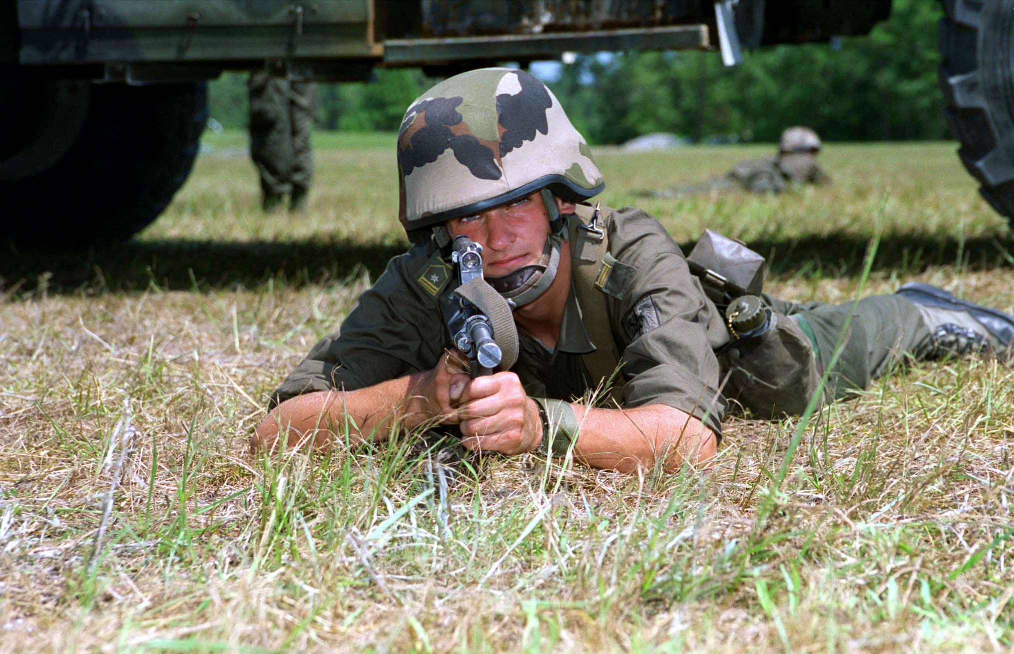File:An Austrian soldier armed with a Steyr AUG rifle sits in his
