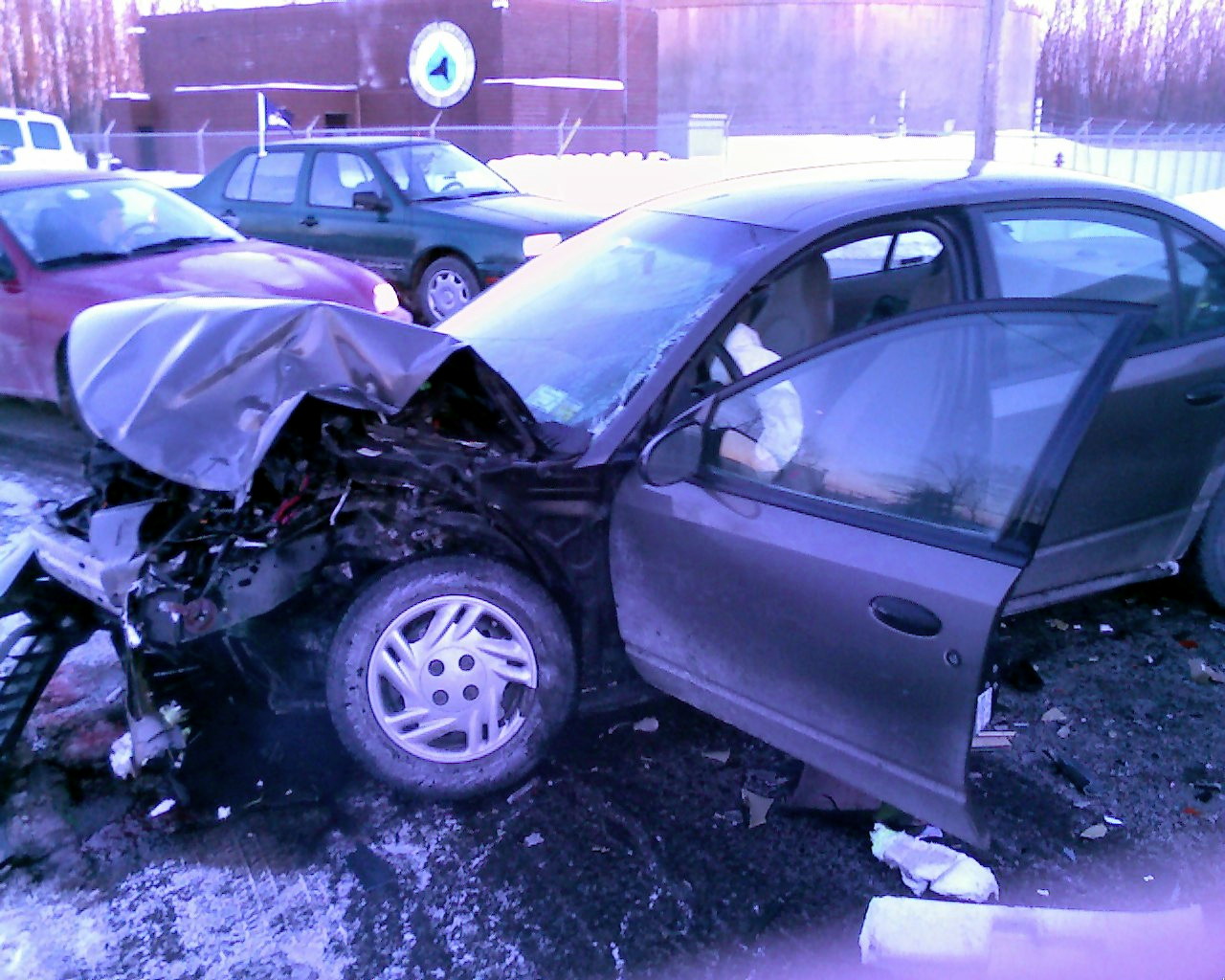 Damaged front end of a Saturn four-door