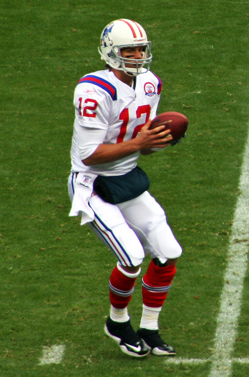 PATRIOTS STAR QUARTERBACK TOM BRADY IN THROWBACK UNIFORM 8x10 photo