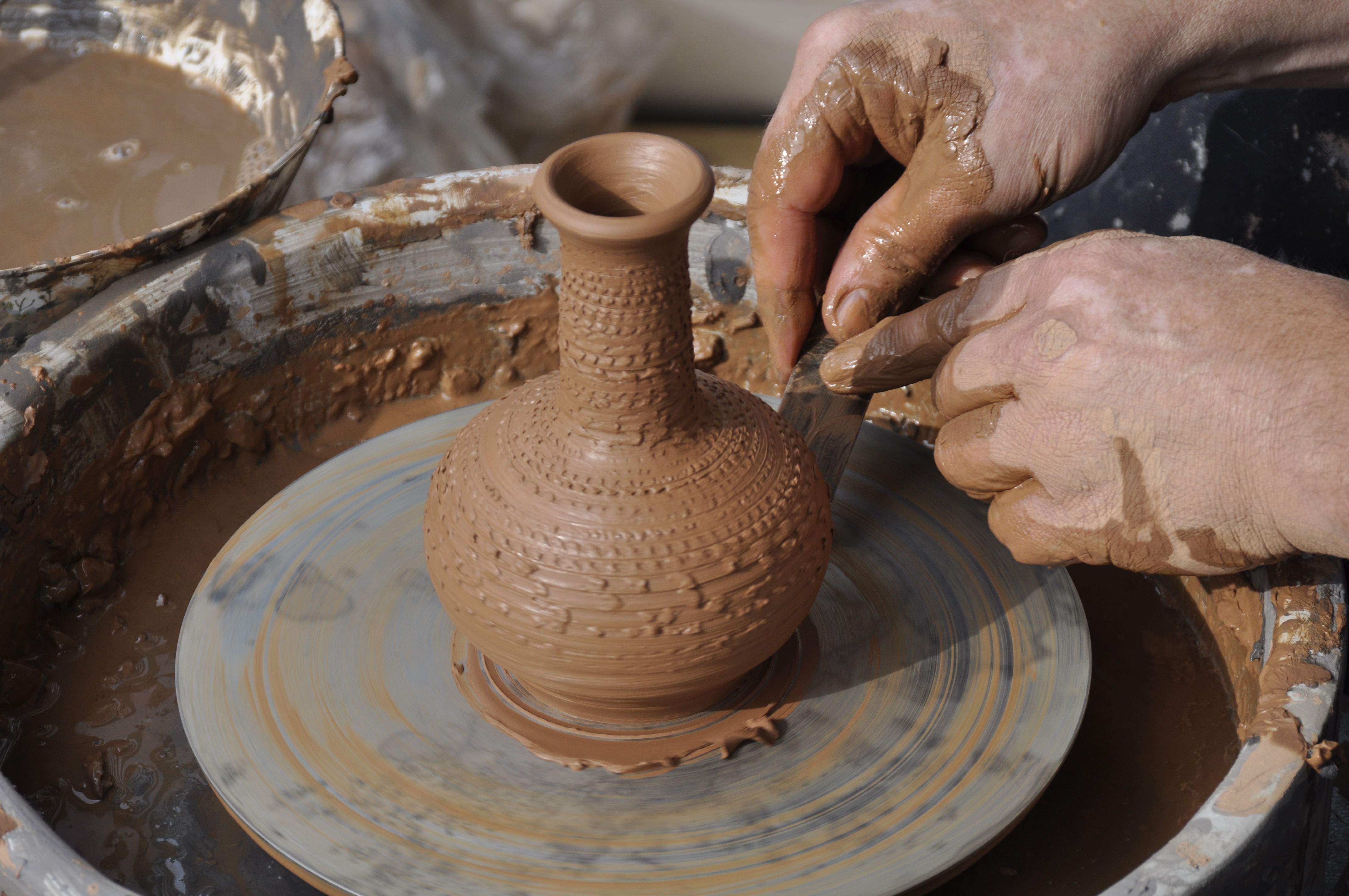 Working on pottery wheel.JPG