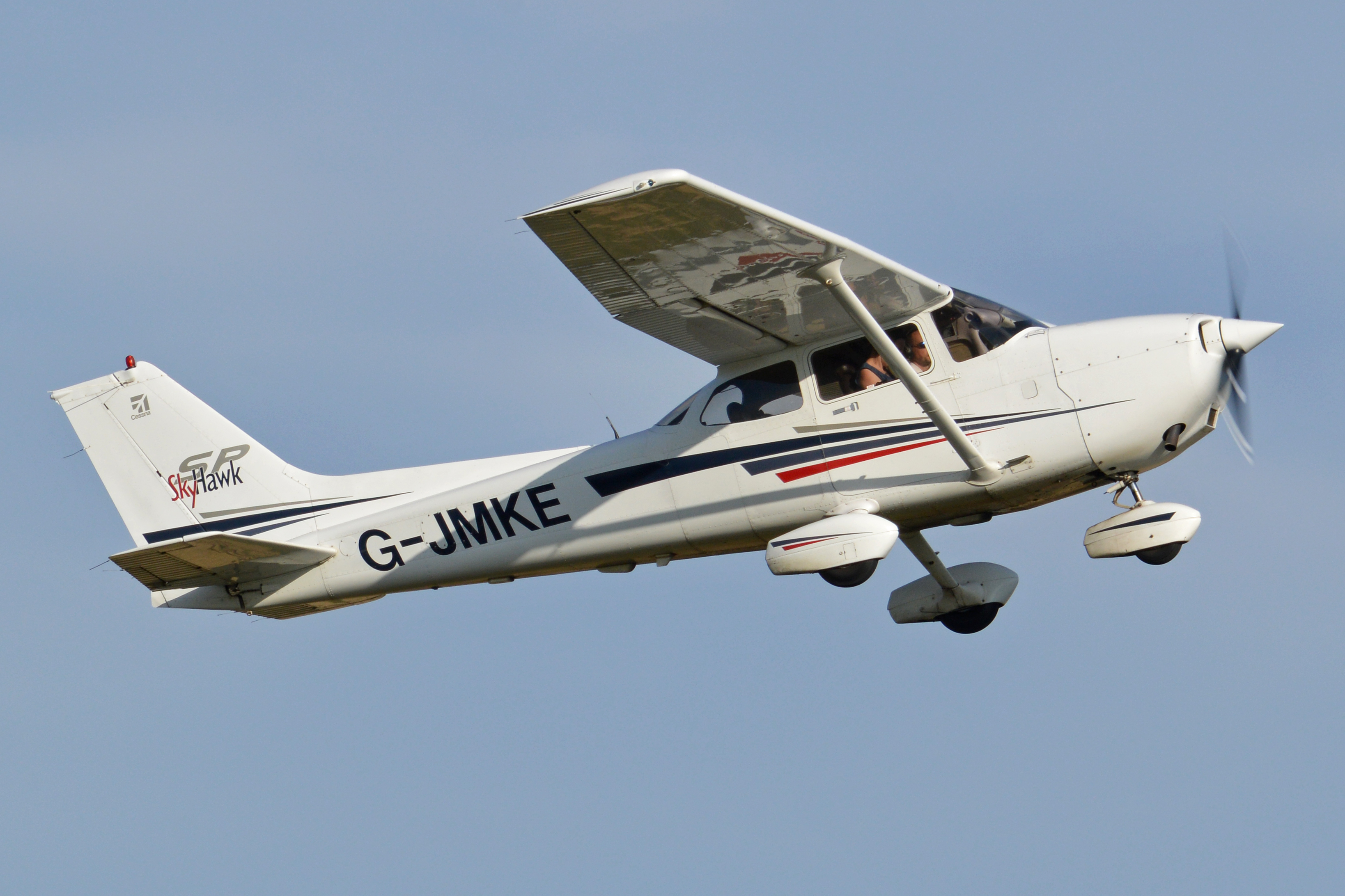 Watch three guys with jetpacks fly in formation with airplanes