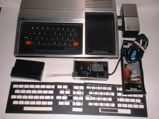 File:1979 TI-99-4 with Speech Synthesizer, RF modulator, keyboard overlays.jpg