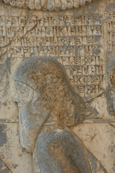 Image of Phraortes on Behistun Inscription in chains, the cuneiform reads "This is Phraortes, He lied saying I am Khshathrita of the dynasty of Cyaxares, I am king in Media"