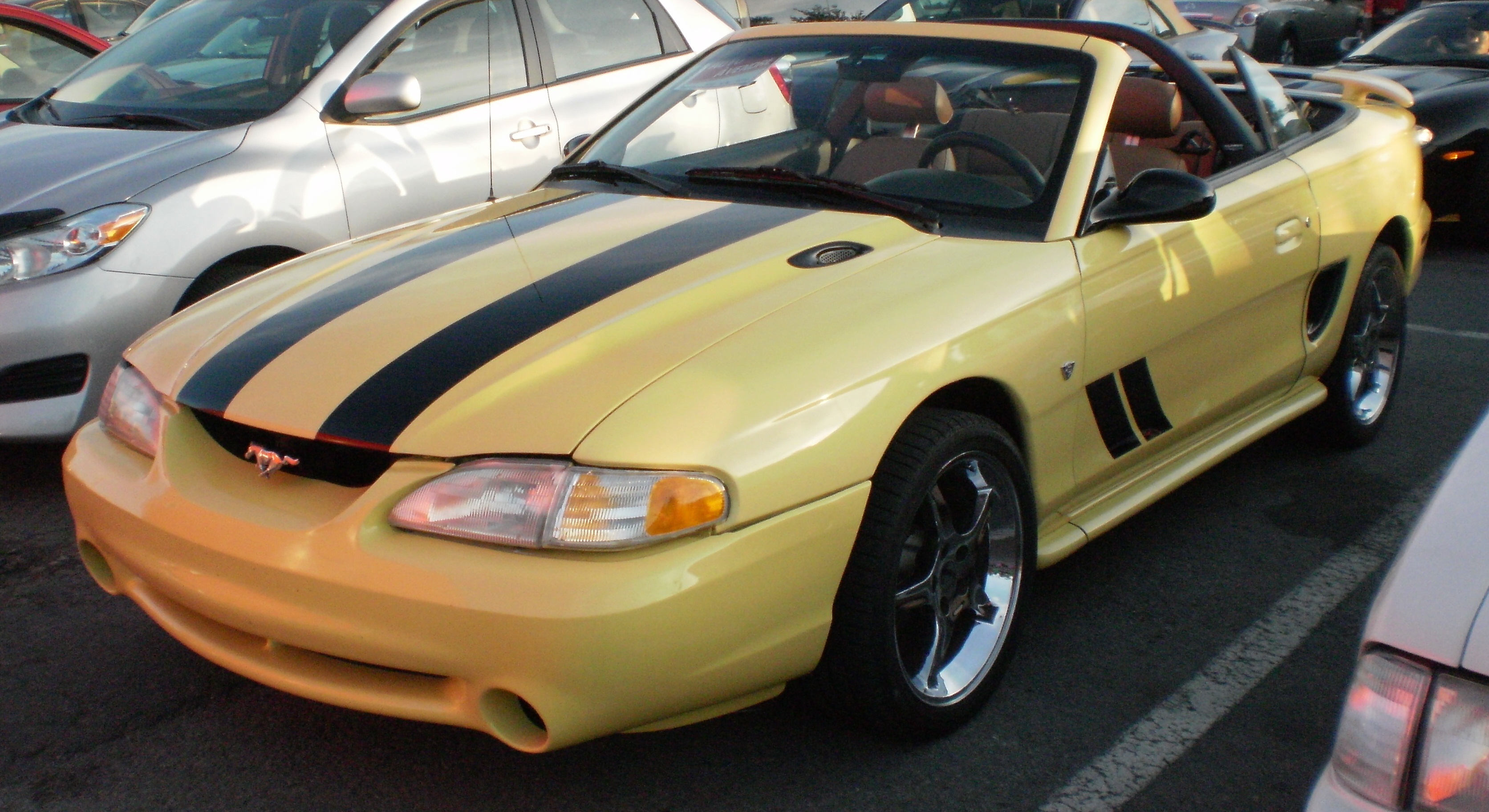 Orange convertible ford mustang #3