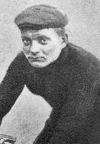 A black-and-white photograph of a young man with a cap.