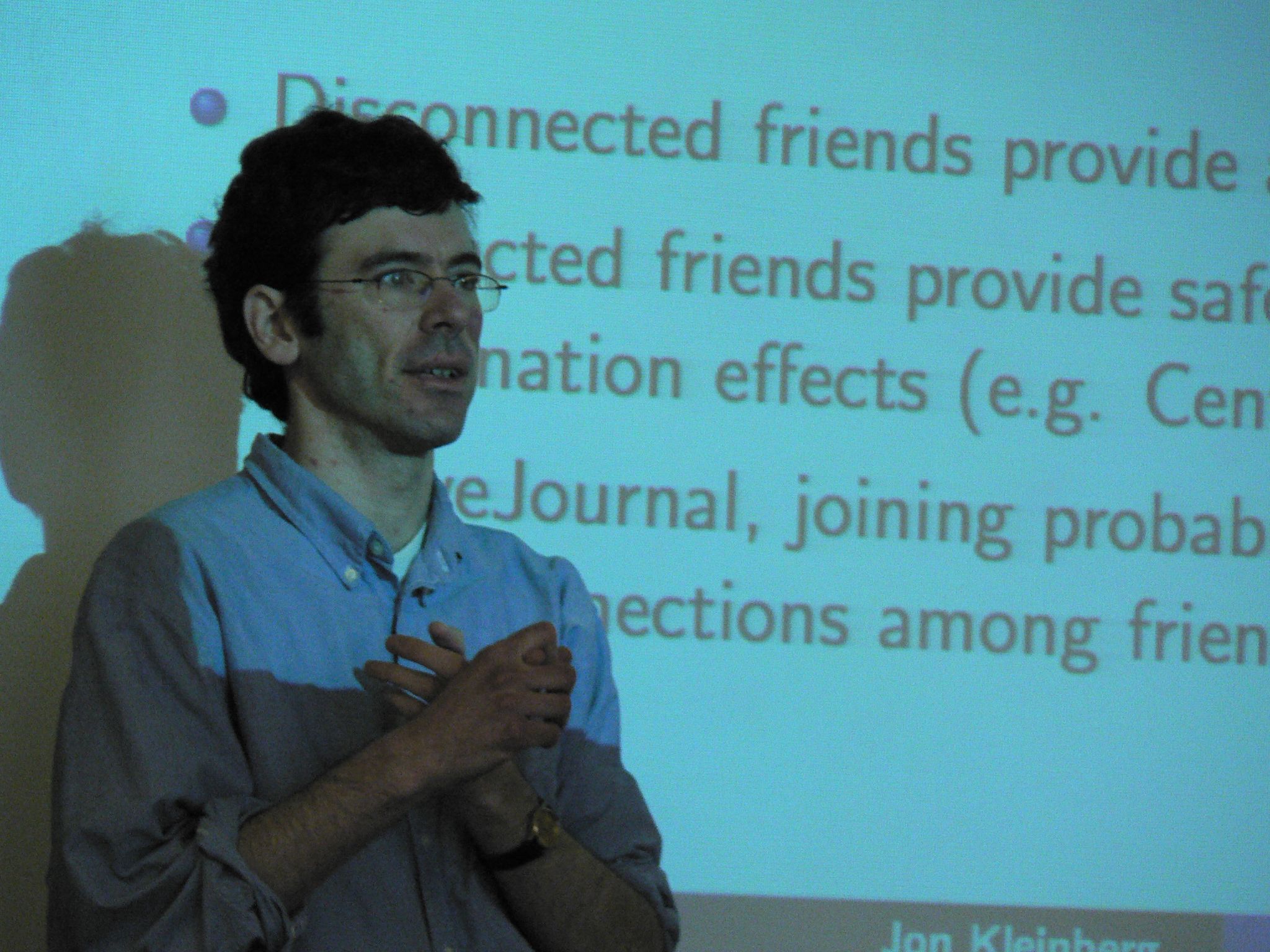 Kleinberg speaking at the Cornell/Microsoft Research International Symposium on Self-Organizing Online Communities