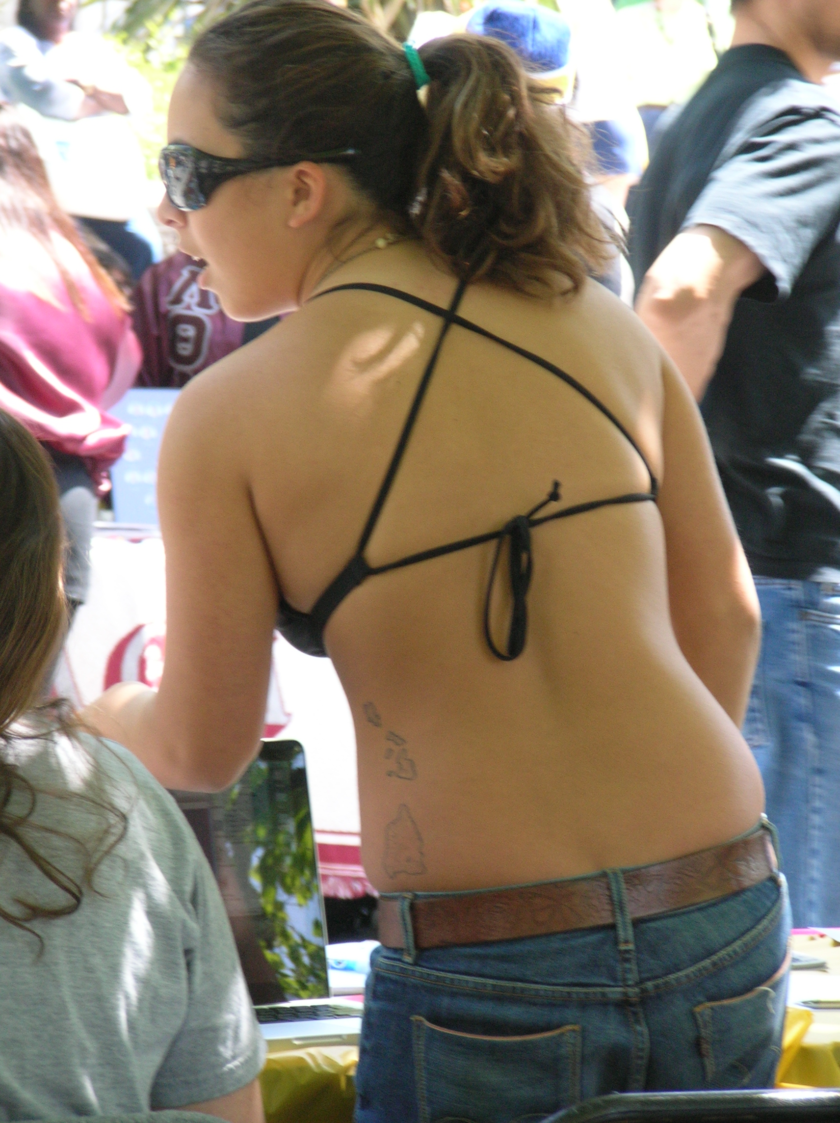 File:Woman in bikini top & jeans tabling at Cal Day 2010.JPG