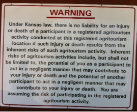 Sign disclaiming legal responsibility at a Kansas agritourism business
