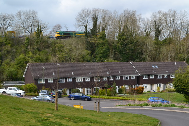 File:Freight train on embankment above houses at Springvale - geograph.org.uk - 4932866.jpg