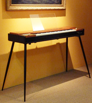 A Clavinet on a stand.